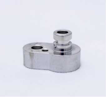 Milled aluminium block with a sleeve and holes
