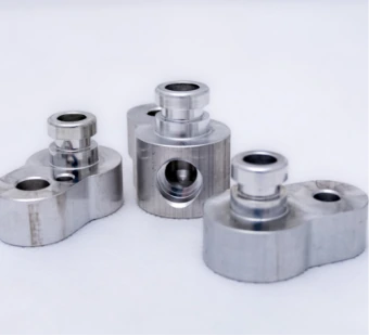 Set of milled aluminium parts with sleeves