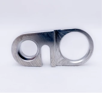 Milled flat aluminium part with two openings